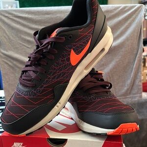 Nike Black and Orange Sneakers with Modern Athletic Silhouette